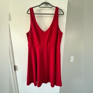 Red cocktail dress. Sleeveless and boob friendly.